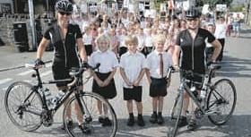 Pedalling pair raise cash for the primary