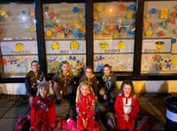 Brownies create window display for TASS