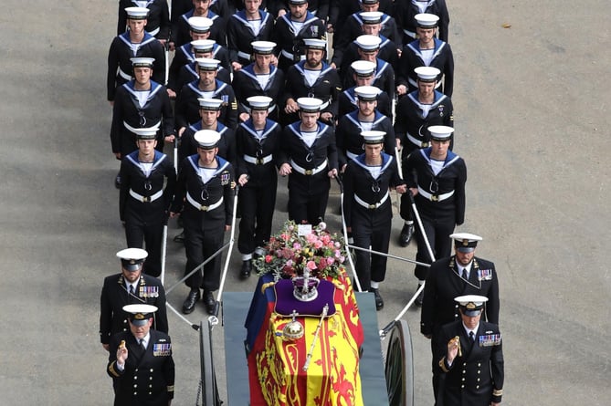 sailors acting as brake on State Gun Carriage