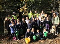 Children sow wildflower meadow outside Dartmoor Prison