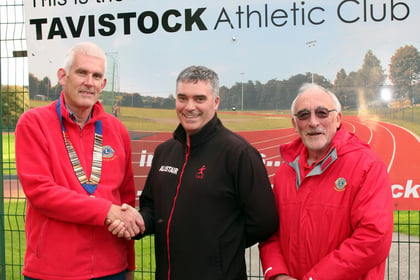 Athletic club hands over £1,000 to Lions
