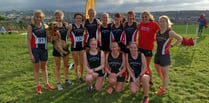 Tavi athletes run by the seaside in Cornwall