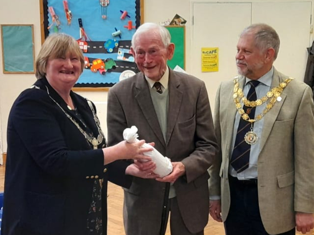 Kasey Jones was presented with a gift at the AGM of the Plymouth and West Devon Talking Newspaper by Councillor Caroline Mott, mayor of West Devon borough and Councillor Paul Ward, mayor of Tavistock to mark his retirement as recording engineer with the charity, a role he has carried out over 23 years.