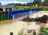 Town barriers stop flooding overseas