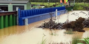 Town barriers stop flooding overseas