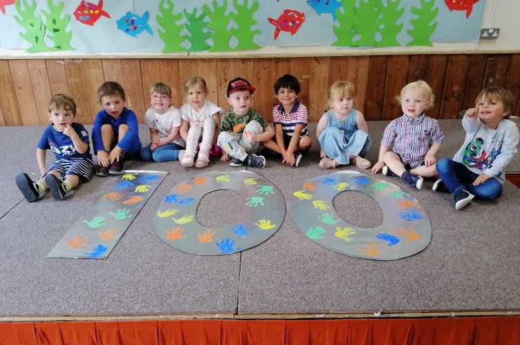 Children at the Buckland Beehive Pre-School help to mark hall's centenary