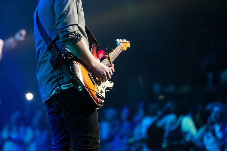 Guitar player in front of audience