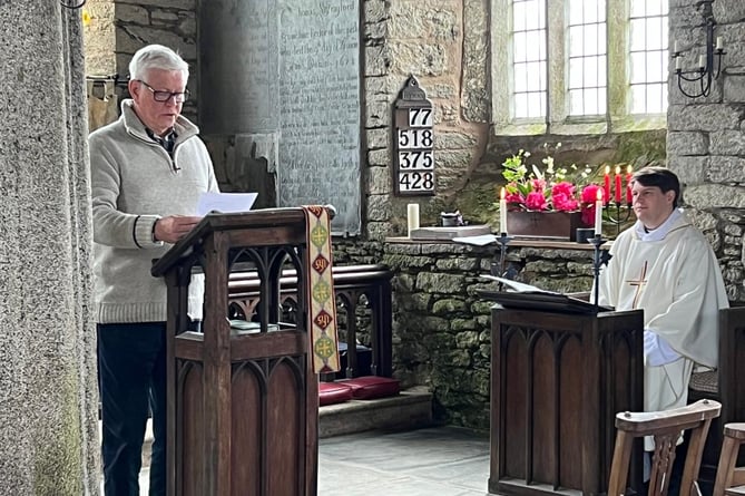 John Spensley, Dunterton Church Warden giving a reading.