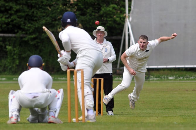 Devon Cricket League A Division.   Abbotskerswell versus Bridestow. Bridstowe's Tom Fogarty hurls down a delivery