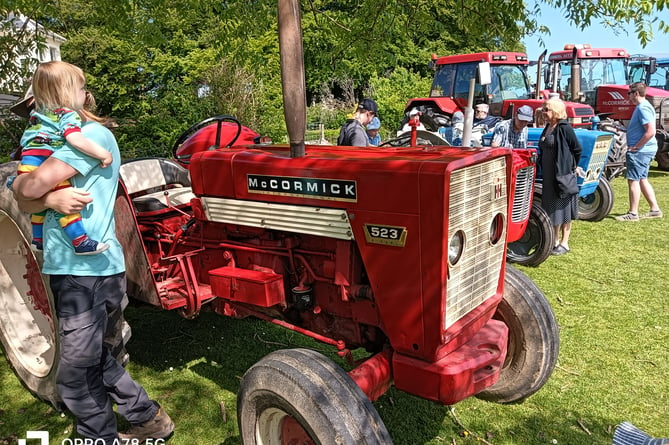 Everyone was attracted by the shiny tractors on parade at Harrowbeer Airfield.