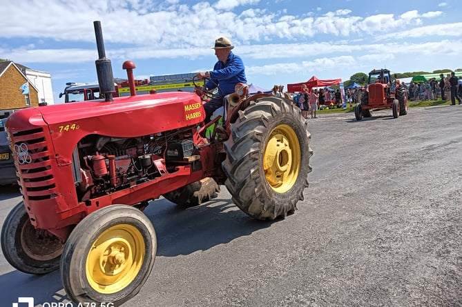 Tractors head off to Princetown from the family fun day on  Harrowbeer Airfield.