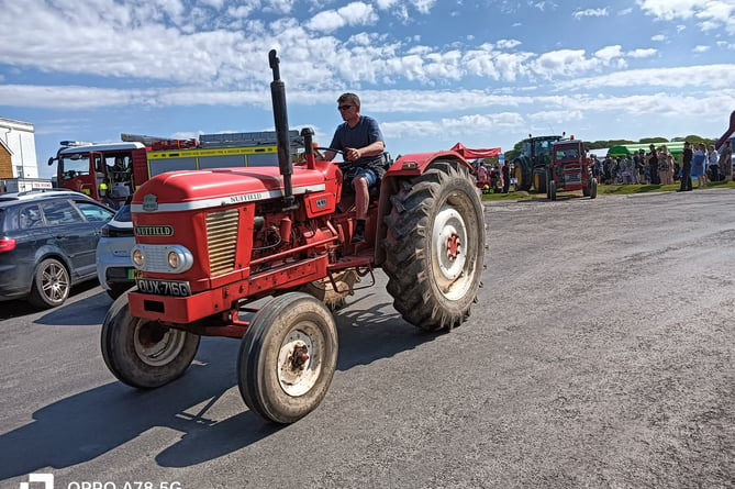 Tractors on the move as they woo the crowds at Harrowbeer Airfield.