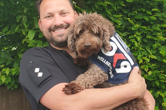 Inspector Nathan Walker and Bertie his wellness dog.