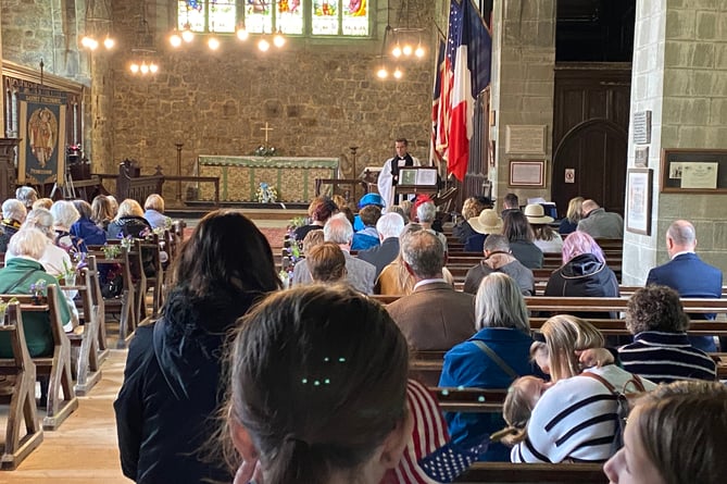 Princetown Church is full for the memorial service visit of the Americans.