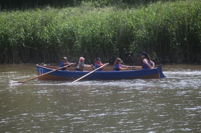 Boat number 17 put their all into their rowing