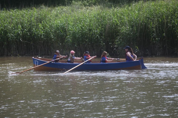 Boat number 17 put their all into their rowing