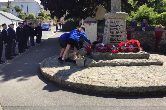 Bere Alston Academy children mark D-Day 80 by laying a wreath at the village war memorial.