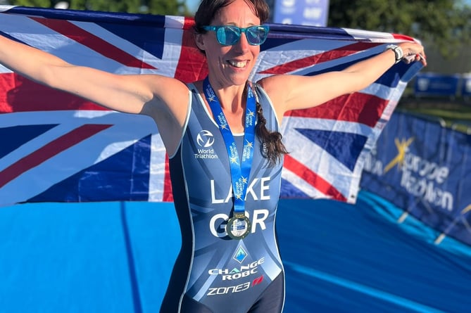 Sam Lake, of Tavistock celebrates European Aquathlon gold in the 45-49 age category.