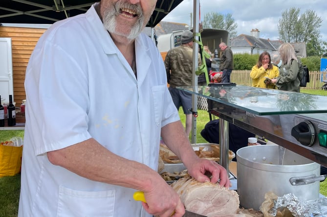 Roger Cudlip served food at the Fair.  AQ 5206
