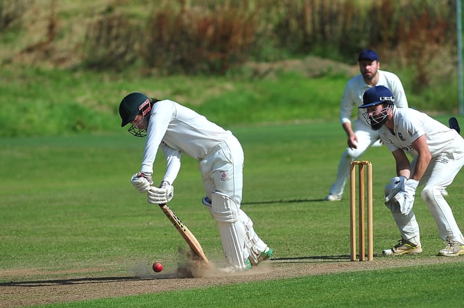 Devon Cricket League D Division West. Kenn 1st XI versus Hatherleigh 2nd XI . Kicking up the dust - Hatherleigh batsman Adam Quick and Kenn 'keeper Ben Chaloner