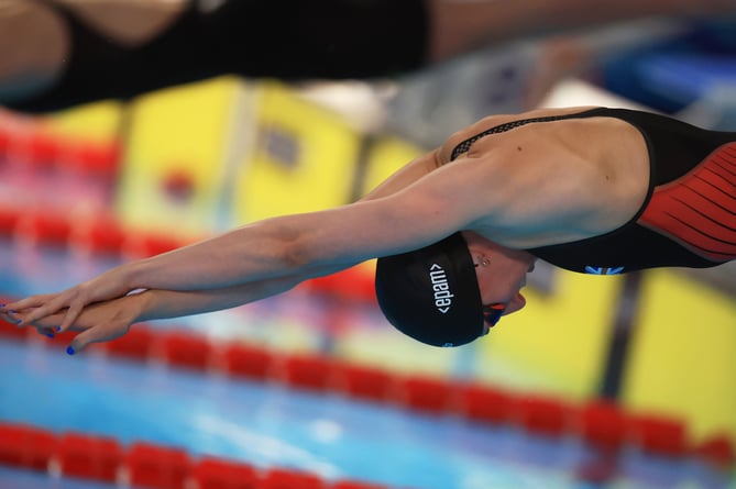 Hollie, diving to success in women's 100m Freestyle.