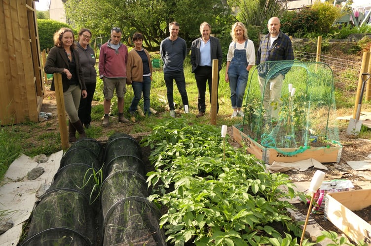 A photo of Cllrs Ursula Mann and Neil Jory with Milton Abbot Allotment Group members