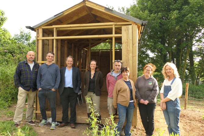 A photo of Cllrs Ursula Mann and Neil Jory with Milton Abbot Allotment Group members