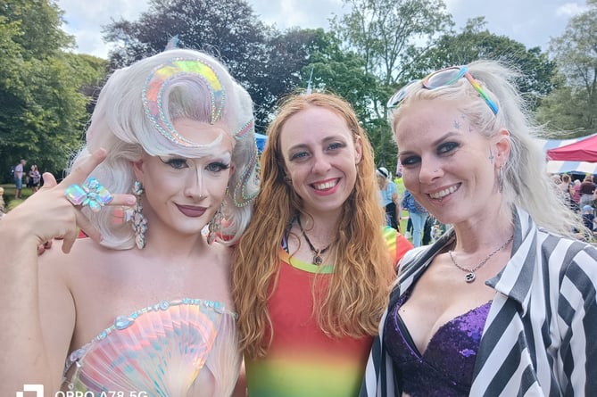 Three friends dress for the fun of Tavi Pride festival.