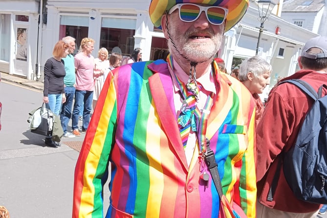 Tavi Pride 's colourful gent gets into the spirit of the event in his rainbow outfit..