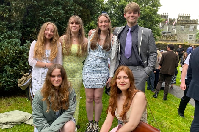 Celebrating as friends at Tavistock College GCSE graduation Isabel Long-Booi, Jessica Cotton, Ella Weeks, Lucas Edwards, and Maya Kearin