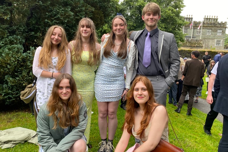 Celebrating as friends at Tavistock College GCSE graduation Isabel Long-Booi, Jessica Cotton, Ella Weeks, Lucas Edwards, and Maya Kearin