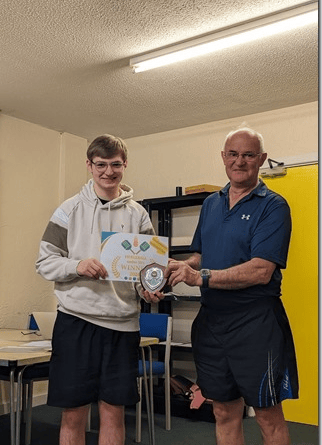 Pickleball player Luke Bennett receives his prize