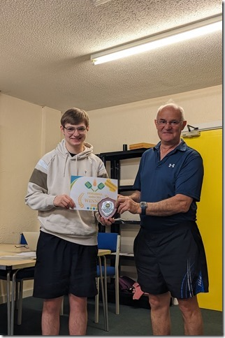 Pickleball player Luke Bennett receives his prize