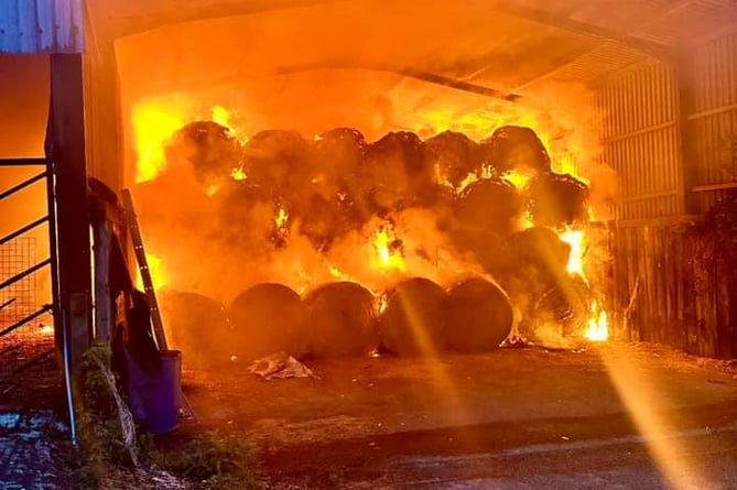 Lawhitton hay well alight in farm barn before firefighters attended