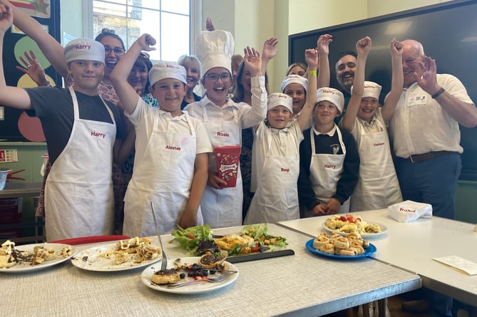 Princetown School judges and children celebrate their cookery success.