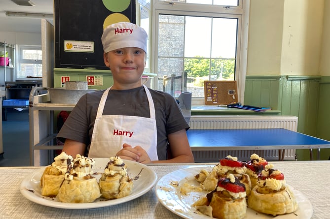 Harry proud of his sweet bakes at Princetown School bake-off competition.