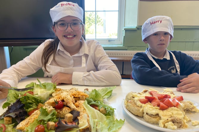 Rosie and Harry impressed with their baking creations at Princetown School bake-off.