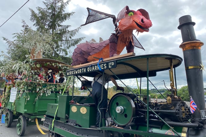 Whitchurch Scouts' dragon sculpture breathing steam on top of their steam engine float.