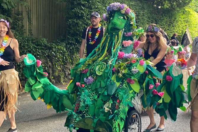 Tavistock St Peter's and St Rumon's schools staff, parents and pupils add an exotic atmosphere to Tavistock Carnival procession.