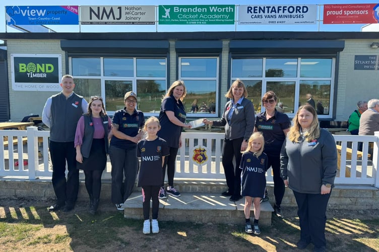 Tavistock Cricket Club girls team receive funds from Tavistock Co-op.