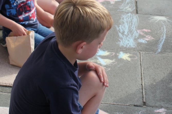 Youngsters practise their artistry on Tavistock pavements for Tavistock Carnival Week