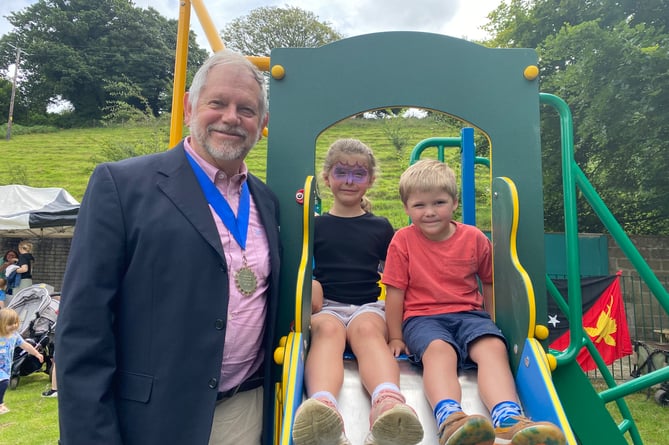 Tavistock Mayor Cllr Paul Ward and siblings Max and Emma helping him ceremonially open Bannawell Park.