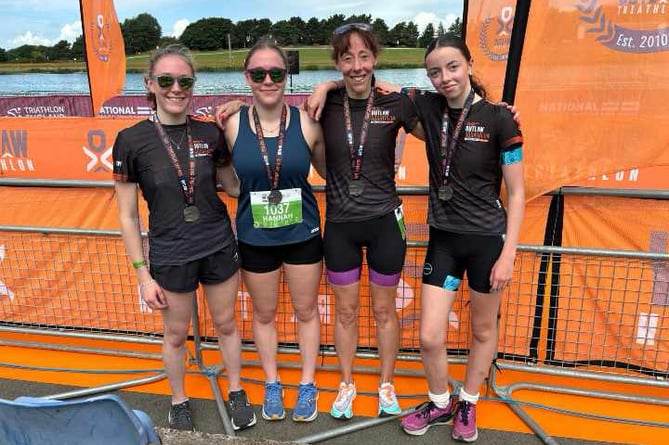 Charlotte and Hannah Walker, Sam and Miley Lake, of Tavistock at National Aquathlon Champs which were hit by algal growth.