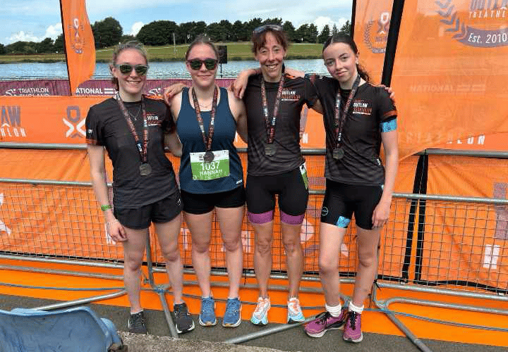 Charlotte and Hannah Walker, Sam and Miley Lake, of Tavistock at National Aquathlon Champs which were hit by algal growth.