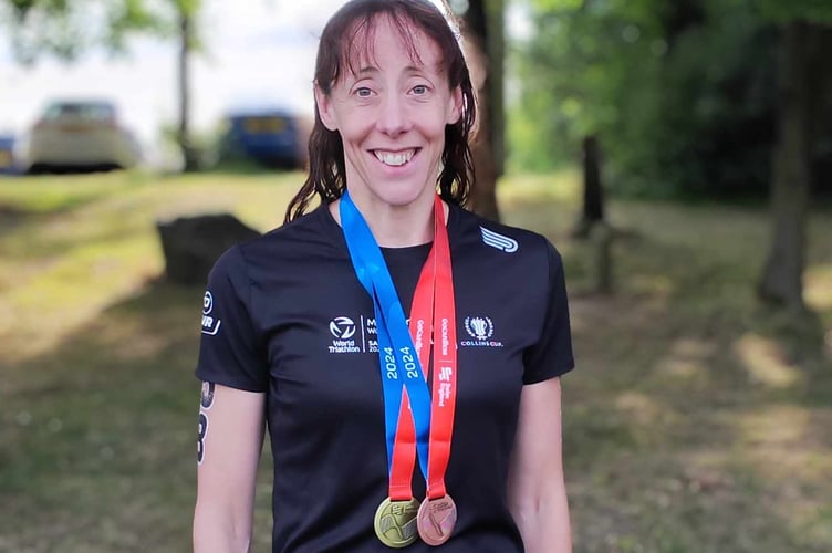 Tavistock Swimming Club's Sam Lake with open water masters champs medals.