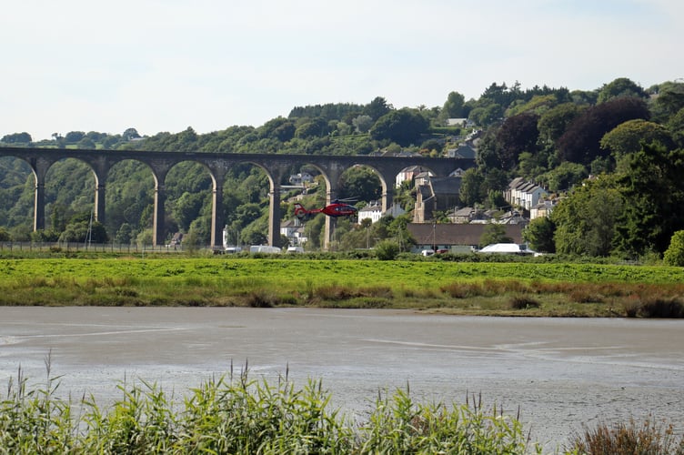 Devon Air Ambulance lands alongside the river at Calstock yesterday early evening.J