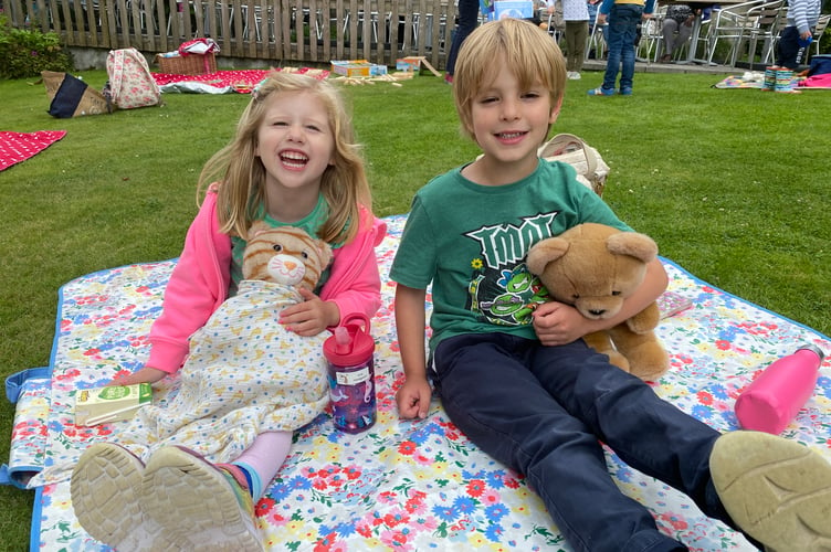 sla Hodgson, 4, with friend Ledro Walcot-Earle Enjoying a Teddy bears' picnic event at The Garden House, Buckland holiday fun.s