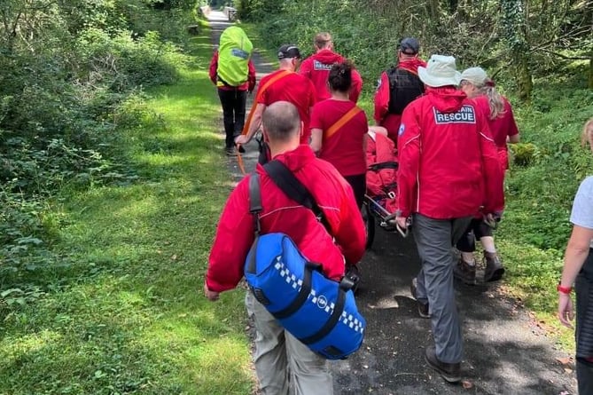 Dartmoor Search and Rescue Tavistock stretcher a woman casualty from Drake's Trail to a waiting ambulance yesterday (Tuesday) after she fell.