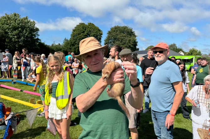 The ferret which escaped during the ferret racing and the member of the public who caught it.
