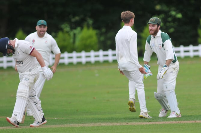 Devon Cricket League D Division West.  Ipplepen 2nd XI versus Hatherleigh 2nd XI, Hatherleigh's Thomas Carroll and 'keeper Paul Penberthy are delighted as Pen's Richard England is dismissed